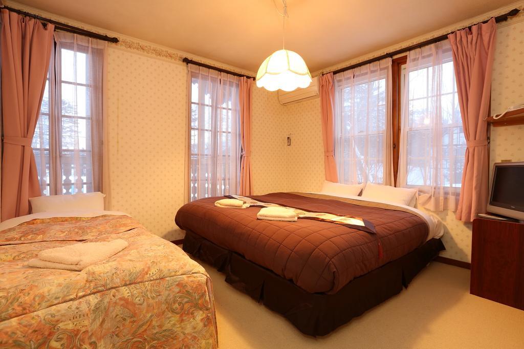 Bed and Breakfast Alpine Wind Хакуба Номер фото