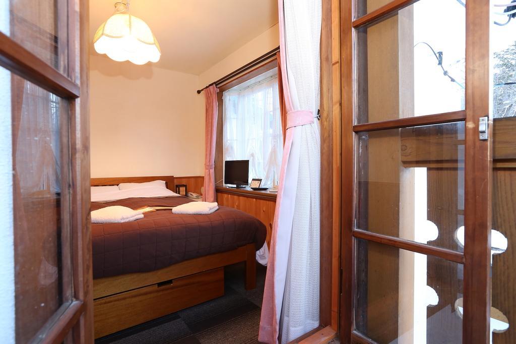 Bed and Breakfast Alpine Wind Хакуба Номер фото